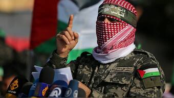 Abu Ubaida, the spokesman of the Izz el-Deen al-Qassam Brigades, gestures as he speaks. File image/ Reuters