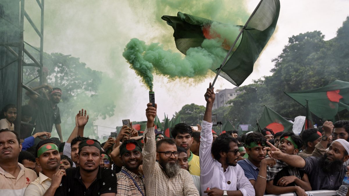 People hold Bangladesh's national flag as they celebrate during a government-organised event in Dhaka on August 5, 2025. AFP People hold Bangladesh's national flag as they celebrate during a government-organised event in Dhaka on August 5, 2025. AFP