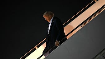 US President Donald Trump disembarks from Air Force One upon arrival at Joint Base Andrews in Maryland. AFP