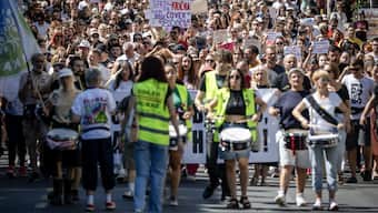 Protesters gather in support of student Nikolina Sindjelic demanding the dismissal of Marko Kricko, commander of the Special Unit for the Protection of Certain Facilities and Persons, as well as his urgent prosecution and sanctioning for the abuse and torture of detainees, in front of a special police unit station in Belgrade. AFP