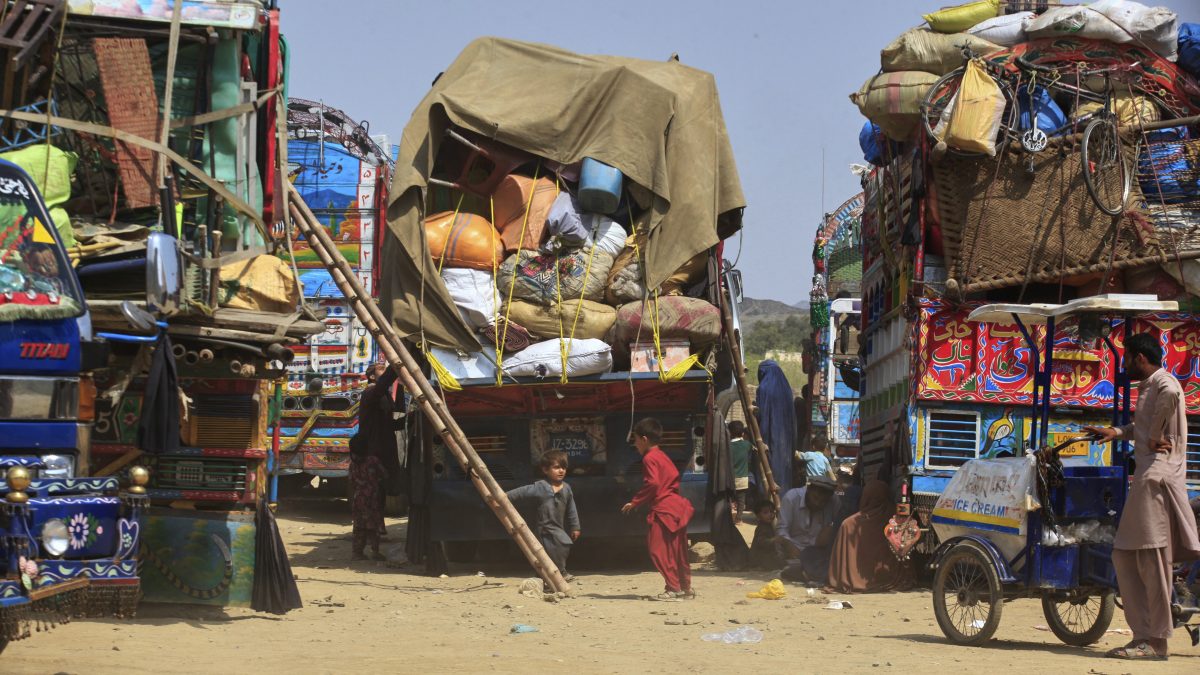 Afghan refugee children play next to trucks loaded with their family's belongings as they wait to return Afghanistan along a highway in Landi Kotal, Pakistan. File image/AP Afghan refugee children play next to trucks loaded with their family's belongings as they wait to return Afghanistan along a highway in Landi Kotal, Pakistan. File image/AP