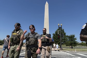 Homeland Security Investigations (HSI) agents patrol the National Mall, Saturday, Aug. 23, 2025, in Washington. AP