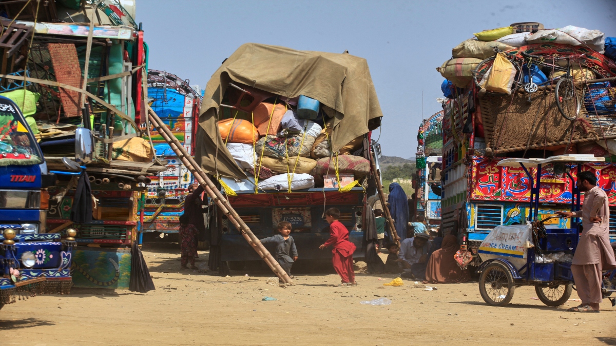 Afghan refugee children play next to trucks loaded with their family's belongings as they wait to return Afghanistan along a highway in Landi Kotal, Pakistan, on April 9, 2025. AP File Afghan refugee children play next to trucks loaded with their family's belongings as they wait to return Afghanistan along a highway in Landi Kotal, Pakistan, on April 9, 2025. AP File