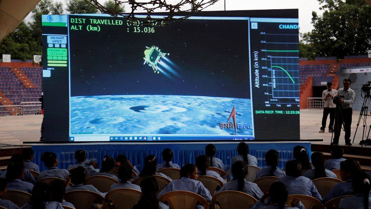 People watch a live stream of Chandrayaan-3 spacecraft's landing on the moon, inside an auditorium of Gujarat Science City in Ahmedabad, India, August 23, 2023. File Image/Reuters