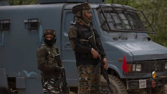 Indian paramilitary soldiers stand guard as police and army soldiers launch an operation in Awantipora area, south of Srinagar, Jammu and Kashmir, on Wednesday, May 6, 2020. (Photo: Dar Yasin/AP)