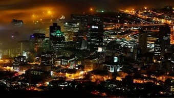 A long exposure picture shows a seasonal fog illuminated by the lights of Cape Town harbour as the city prepares for the start of the southern hemisphere winter, May 8, 2012. (Photo: Mike Hutchings/Reuters)
