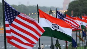 The undated photograph shows US and Indian flags in the vicinity of the India Gate (seen in the background) in New Delhi, India. Image courtesy US Embassy in India