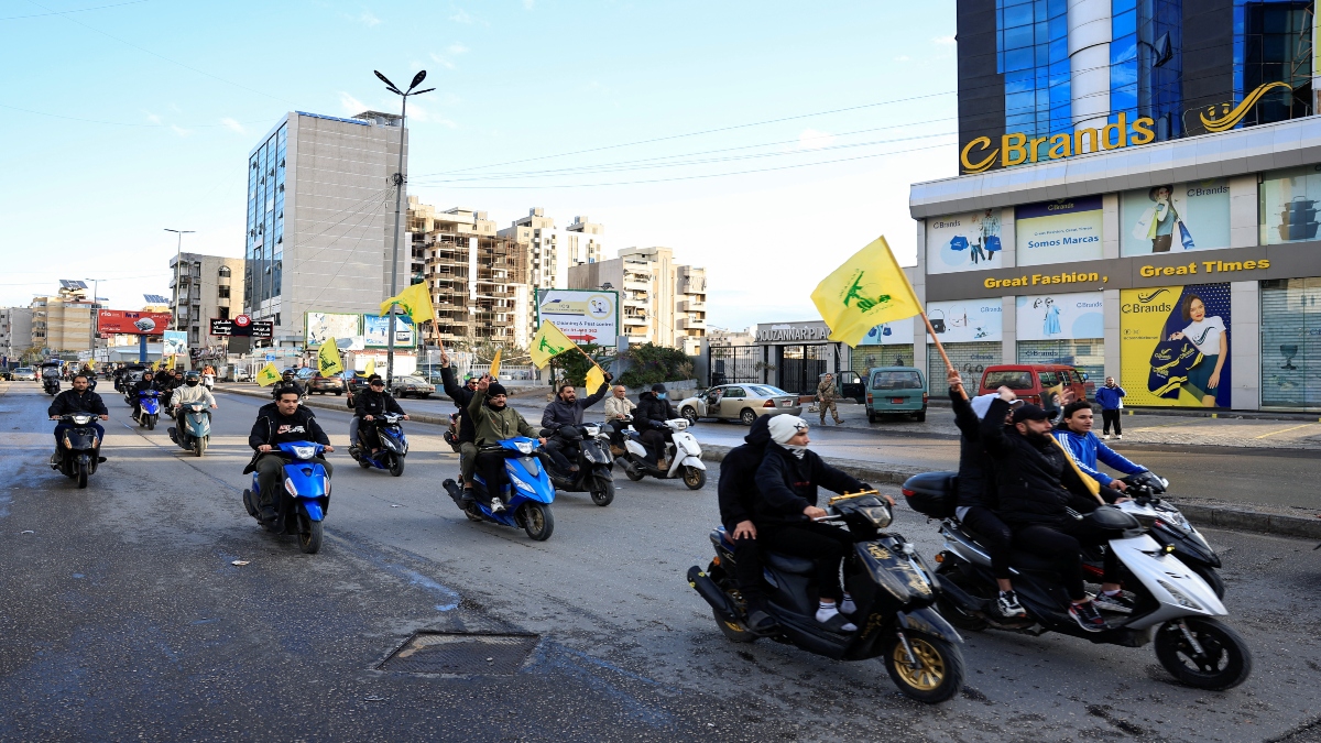 Men carry Hezbollah flags while riding on two wheelers, at the entrance of Beirut's southern suburbs, in Lebanon, on November 27, 2024. Reuters File Men carry Hezbollah flags while riding on two wheelers, at the entrance of Beirut's southern suburbs, in Lebanon, on November 27, 2024. Reuters File