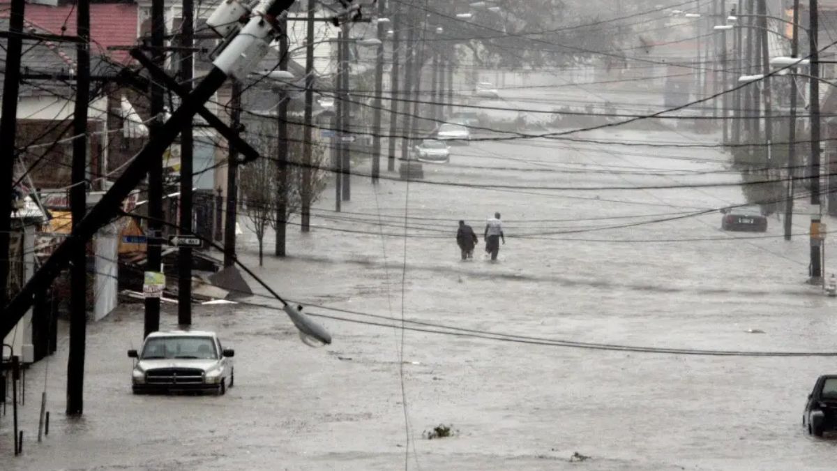 People walk down flooded street as Hurricane Katrina hits New Orleans, Louisiana. File image/AP People walk down flooded street as Hurricane Katrina hits New Orleans, Louisiana. File image/AP