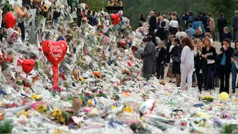 Mourners file past tributes left in memory of Diana, Princess of Wales at Kensington Palace in London on September 5, 1997. File image/AP