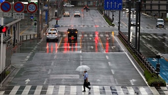 Passersby holding umbrellas walk on the street in the rains and winds caused by Typhoon Shanshan in Fukuoka, Japan, August 30, 2024. Representational Image/Reuters