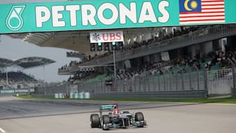 Formula 1 legend Michael Schumacher steers her Mercedes car down the finishing straight at the Sepang International Circuit during the qualifying session for the Malaysian Grand Prix in 2012. Reuters