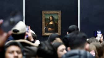 Visitors take pictures of the painting "Mona Lisa" (La Joconde) by Leonardo da Vinci at the Louvre Museum in Paris, France, January 29, 2025. File Image/Reuters