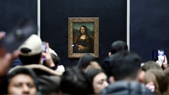 Visitors take pictures of the painting "Mona Lisa" (La Joconde) by Leonardo da Vinci at the Louvre Museum in Paris, France, January 29, 2025. File Image/Reuters