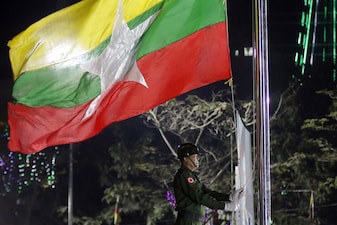 (File) A Myanmar military soldier hoists a national flag during a ceremony to mark the 69th anniversary of Independence Day in Yangon, Myanmar on Jan. 4, 2017. AP