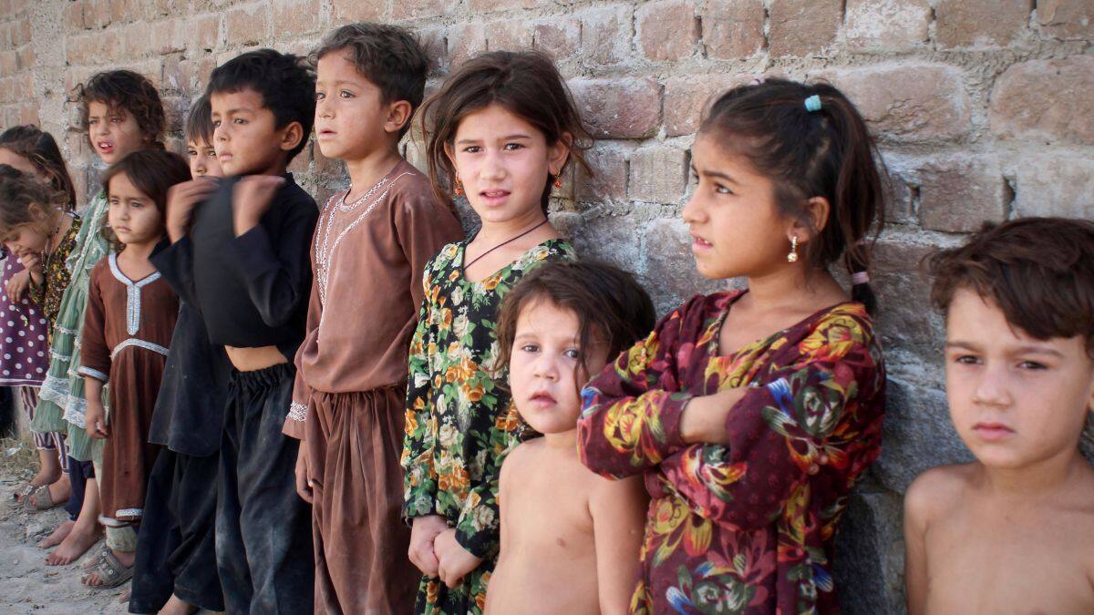 Afghan children wait in line to get a polio vaccine in Jalalabad, Afghanistan, May 26, 2025. File Image/AP