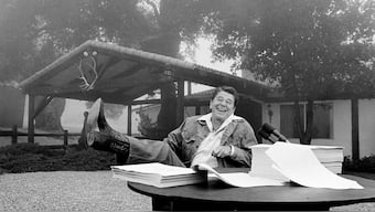 (File) President Ronald Reagan shows his boot following the signing of his tax bill at his California vacation home, Rancho del Cielo, near Santa Barbara, Ca., Aug. 13, 1981. AP