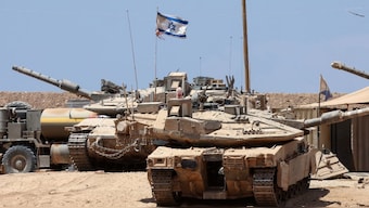 Israeli troops deploy with their tanks near the border fence with the Gaza Strip on August 1, 2025. Image- AFP