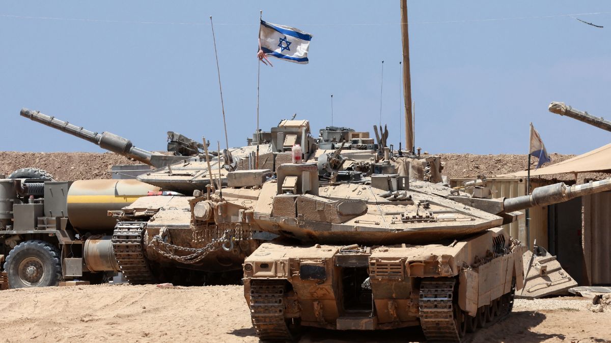 Israeli troops deploy with their tanks near the border fence with the Gaza Strip on August 1, 2025. AFP Israeli troops deploy with their tanks near the border fence with the Gaza Strip on August 1, 2025. AFP