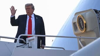 US President Donald Trump waves as he boards Air Force One as he departs Joint Base Andrews in Maryland on August 15, 2025, en route to Anchorage. Image- AFP