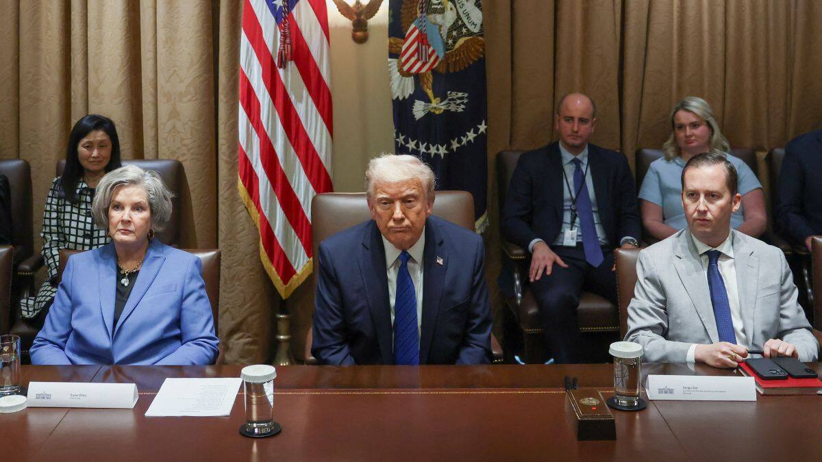 US President Donald Trump reacts as Director Presidential Personnel Office Sergio Gor and White House Chief of Staff Susie Wiles sit next to him on the day of a meeting with US ambassadors at the White House in Washington, DC, US, March 25, 2025. File Image/Reuters