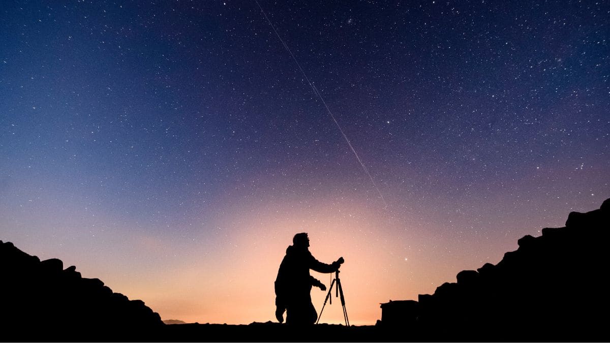 In this long exposure photo, Starlink satellites are visible in the sky near Salgotarjan, Hungary, early Monday, November 25, 2019. File Image/MTI via AP