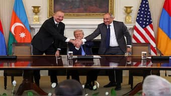US President Donald Trump holds the hands of Azerbaijan's President Ilham Aliyev and Armenia's Prime Minister Nikol Pashinyan as they shake hands between each other during a trilateral signing event, at the White House, in Washington, D.C., August 8, 2025. REUTERS/Kevin Lamarque
