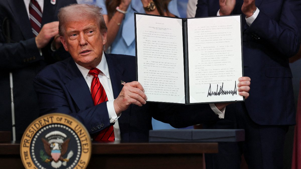 US President Donald Trump poses with the executive order to create a White House Olympics task force to handle security and other issues related to LA 2028 Summer Olympics. Image: Reuters US President Donald Trump poses with the executive order to create a White House Olympics task force to handle security and other issues related to LA 2028 Summer Olympics. Image: Reuters
