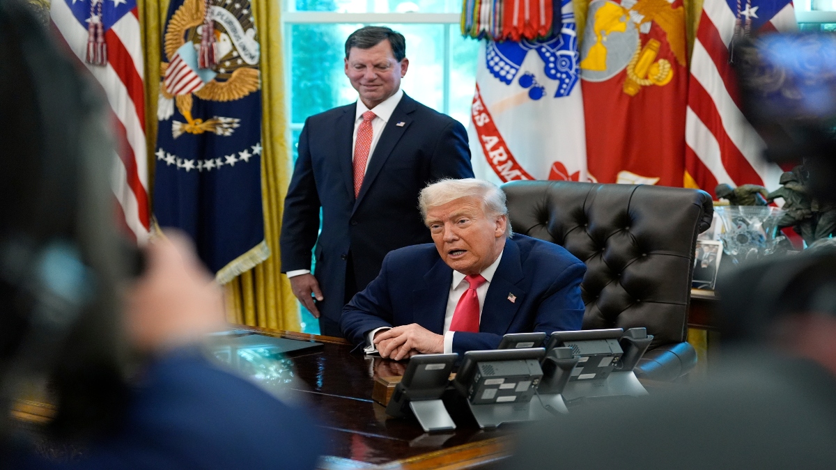 President Donald Trump speaks with reporters as Social Security Commissioner Frank Bisignano listens during an event in the Oval Office to mark the 90th anniversary of the Social Security Act, on Thursday, in Washington. AP President Donald Trump speaks with reporters as Social Security Commissioner Frank Bisignano listens during an event in the Oval Office to mark the 90th anniversary of the Social Security Act, on Thursday, in Washington. AP