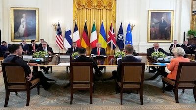 President Donald Trump, seated center, speaks during a meeting with British Prime Minister Keir Starmer, seated from left, France's President Emmanuel Macron and Germany's Chancellor Friedrich Merz in the East Room of the White House, Monday, on Monday, in Washington. AP
