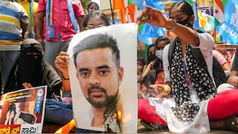 NSUI members burn a poster of JD(S) MP Prajwal Revanna during a protest against his involvement in the alleged sexual abuse case, in Bengaluru, Tuesday, April 30, 2024. File Photo/PTI