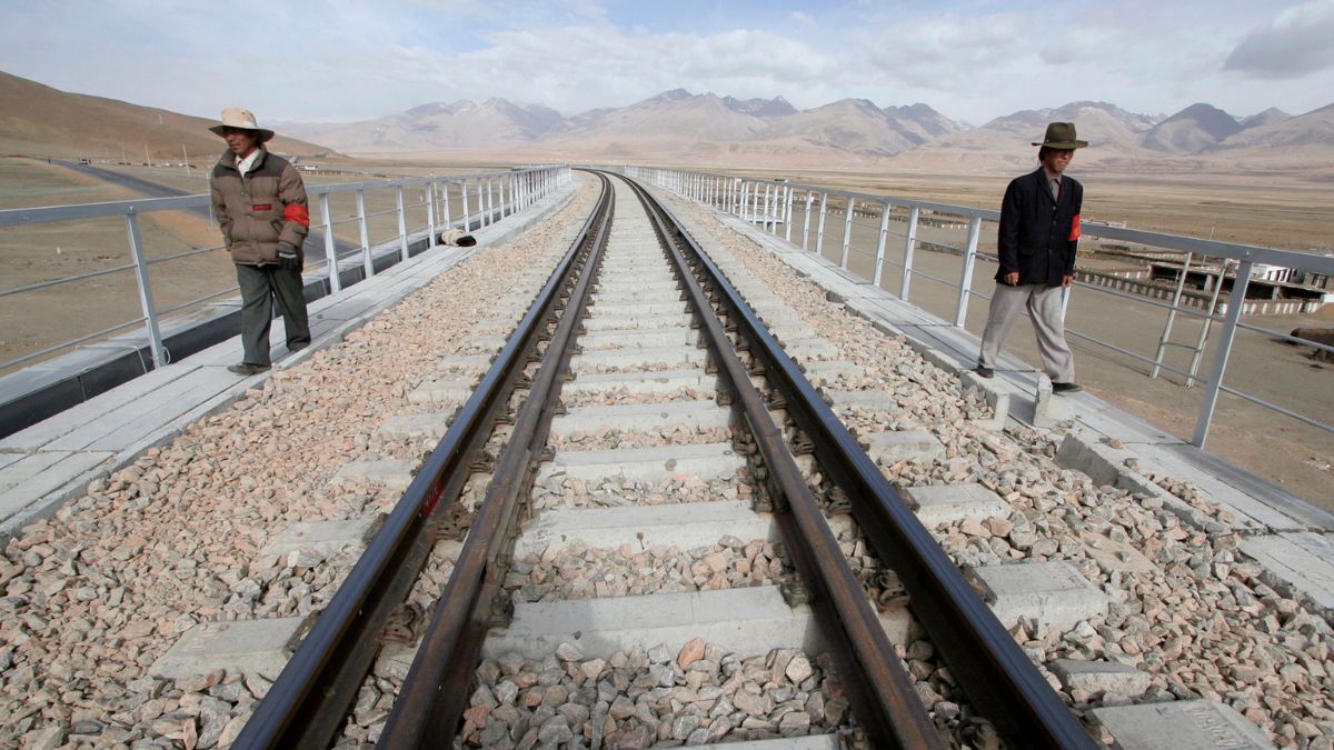 Two workers walk along the Qinghai-Tibet Railway as they check the railway track in Dangxiong county of the Tibet Autonomous Region, April 20, 2007. File Photo/Reuters Two workers walk along the Qinghai-Tibet Railway as they check the railway track in Dangxiong county of the Tibet Autonomous Region, April 20, 2007. File Photo/Reuters