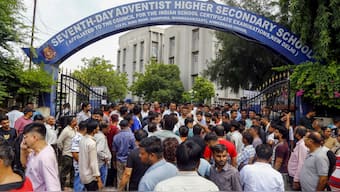 People gather in protest after a class 10 student was stabbed to death allegedly by his junior on Tuesday after a minor scuffle, at the Seventh Day Adventist School, in Ahmedabad, Gujarat, August 20, 2025. PTI