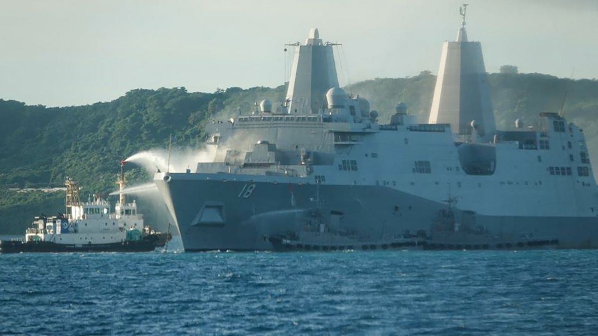 This handout photo taken on August 20, 2025 and received on August 21, 2025 from the Japan Coast Guard shows smoke coming from the US Navy vessel USS New Orleans as water is sprayed (L) to help put out the fire. AFP This handout photo taken on August 20, 2025 and received on August 21, 2025 from the Japan Coast Guard shows smoke coming from the US Navy vessel USS New Orleans as water is sprayed (L) to help put out the fire. AFP
