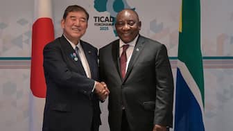 Japan's Prime Minister Shigeru Ishiba (L) shakes hands with South Africa's President Cyril Ramaphosa at their bilateral meeting on the sidelines of the second day of the 9th Tokyo International Conference on African Development (TICAD 9) in Yokohama, Kanagawa prefecture, south of Tokyo on August 21, 2025. AFP
