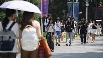 Chinese students walk at Beijing Foreign Studies University in Beijing on May 29, 2025. File Photo/AFP