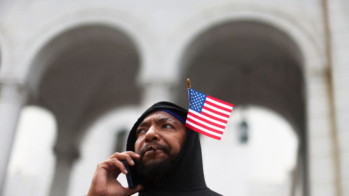 A man with a US flag tucked into his hood uses a phone, during a protest against federal immigration sweeps, in Los Angeles, California, US, June 14, 2025. File Photo/Reuters A man with a US flag tucked into his hood uses a phone, during a protest against federal immigration sweeps, in Los Angeles, California, US, June 14, 2025. File Photo/Reuters