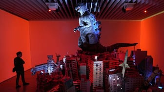 A man visiting the exhibition commemorating the 70th anniversary of Godzilla's birth, titled GODZILLA THE ART at Tokyo's Mori Arts Center Gallery. AFP