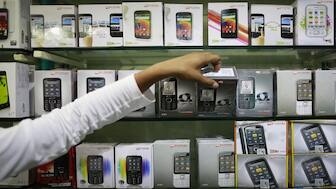 A GST revamp is on the cards and it is expected to be rolled out by Diwali. According to sources, mobile phones and other items will become cheaper. File image/Reuters