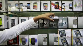 A GST revamp is on the cards and it is expected to be rolled out by Diwali. According to sources, mobile phones and other items will become cheaper. File image/Reuters