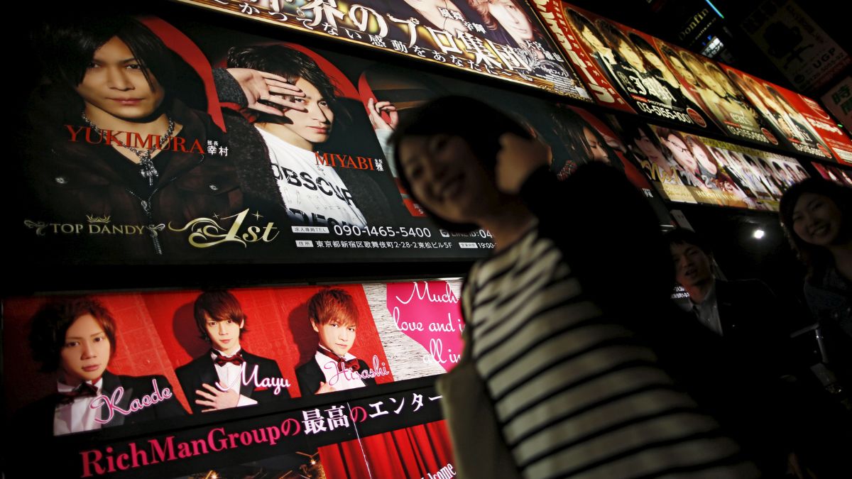 Passersby walk past in front of an illuminated advertising board of a gigolo club called "host club" in Kabukicho, Tokyo's biggest amusement district. File image/reuters Passersby walk past in front of an illuminated advertising board of a gigolo club called "host club" in Kabukicho, Tokyo's biggest amusement district. File image/reuters
