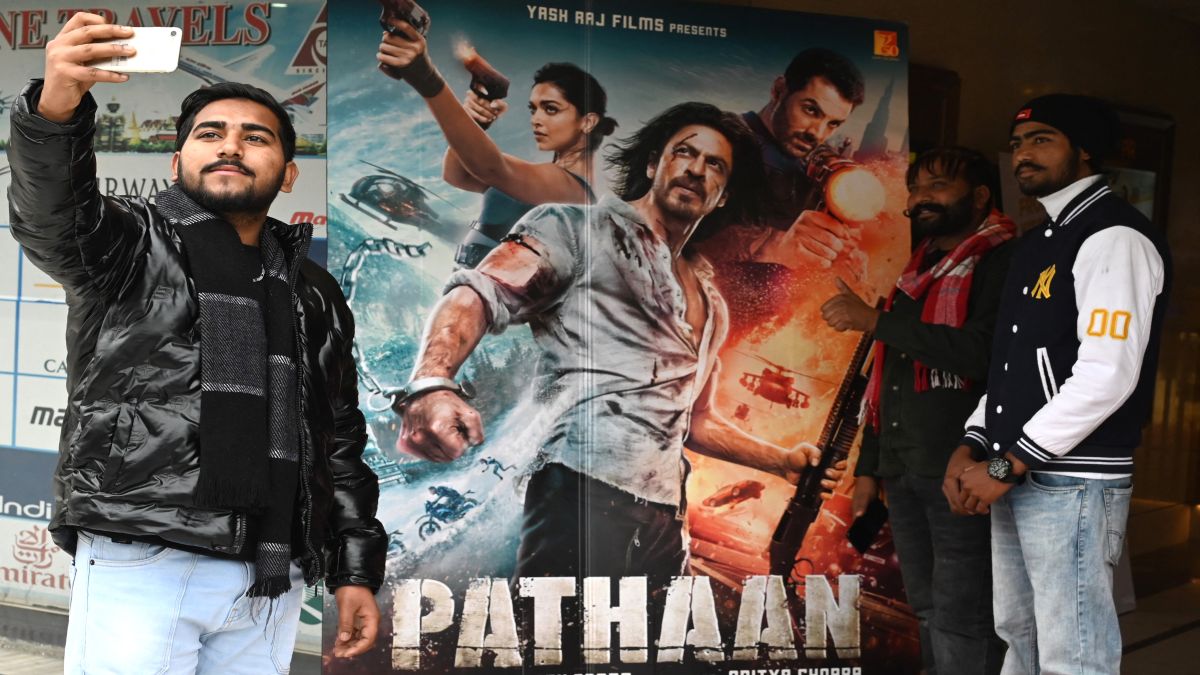 Moviegoers take their pictures in front of a poster of the Bollywood movie 'Pathaan' at a cinema hall in Amritsar. Movies, namely Bollywood, has been one of India's biggest gifts to the world at large. File image/AFP Moviegoers take their pictures in front of a poster of the Bollywood movie 'Pathaan' at a cinema hall in Amritsar. Movies, namely Bollywood, has been one of India's biggest gifts to the world at large. File image/AFP