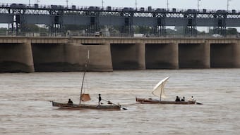 Fishermen ride their boats in the Indus River. India's decision to pause the Indus Waters Treaty has led to several Pakistani officials to issue  threats. File image/AFP