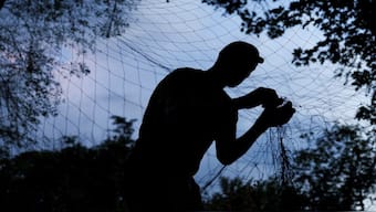 A service member of the 13th Operative Purpose Brigade 'Khartiia' of the National Guard of Ukraine installs an anti-drone net at a position in a front line, amid Russia's attack on Ukraine, in Kharkiv region, Ukraine. Reuters