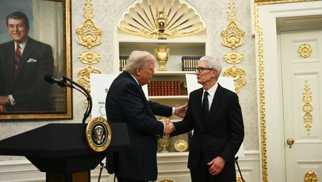 US President Donald Trump shakes hands with Apple CEO Tim Cook in the Oval Office of the White House in Washington, DC, on August 6, 2025 