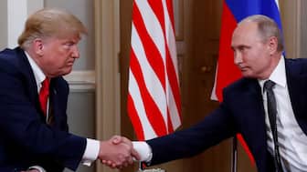 US President Donald Trump and with his Russian counterpart Vladimir Putin. Reuters File 