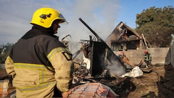Firefighters work at the site of a Russian missile strike, amid Russia's attack on Ukraine, in the village of Sknyliv on the outskirts of Lviv, Ukraine. Reuters