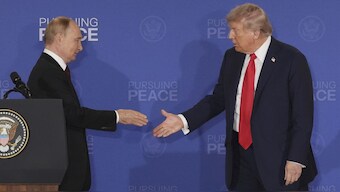 US President Donald Trump walks to shake the hand of Russia's  Vladimir Putin during a joint press conference at Joint Base Elmendorf-Richardson, Alaska, Friday. After a three-hour meeting, Trump said 'we didn't get there' on a Ukraine deal. AP