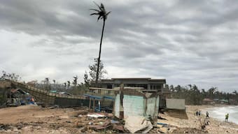 A fishing boat is washed ashore near houses in Calayan Island, Cagayan province, a day after Super Typhoon Ragasa hit the island. AFP/File Photo
