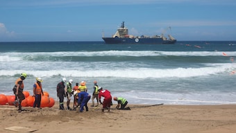 (File) Workers install an undersea cable. Reuters